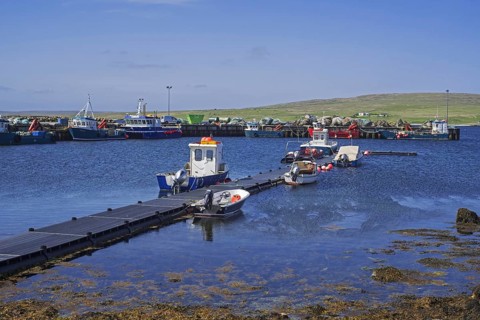 Fish farming workboats in the harbour of Uyeasound on the Isle of Unst