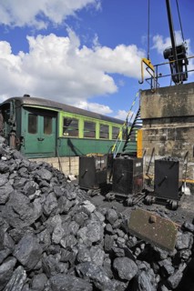 Crane and heap of coal as fuel for steam train at the depot of the Chemin de Fer a Vapeur des Trois Vallees at Mariembourg
