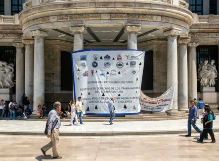 Protest posters banners outside Palacio de Bellas Artes