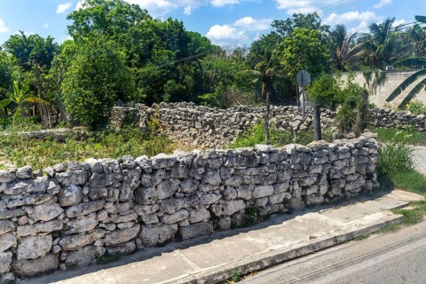 View from bus window of carboniferous limestone stone blocks in dry stone walls