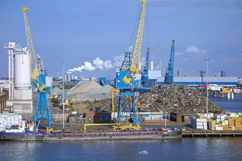 Dock cranes and scrap metal heap in the Aberdeen port