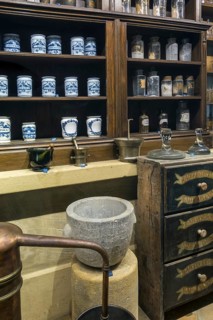 Antique pharmacy cabinet with vintage jars at the Orval Abbey