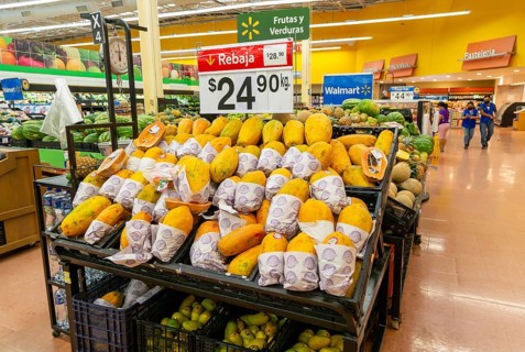 Goods and produce on display inside Walmart superstore shop store