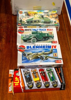 Boxes of Airfix military models on display in auction room