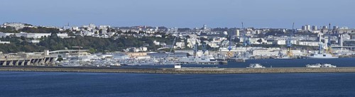 Panoramic view over German WW2 U-boat submarine pen and French Navy ships docked in the port