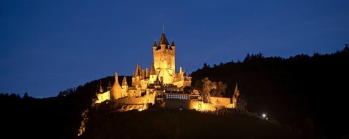 Illuminated Reichsburg Cochem in the evening