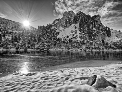 Frozen lake with mountain and snow