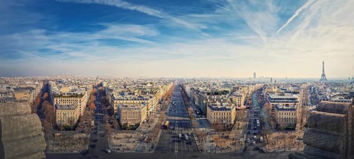 Wide angle Paris cityscape panorama from the triumphal arch with view to parisian avenues and Champs-Elysee in the center. Beautiful architectural landmarks on the horizon
