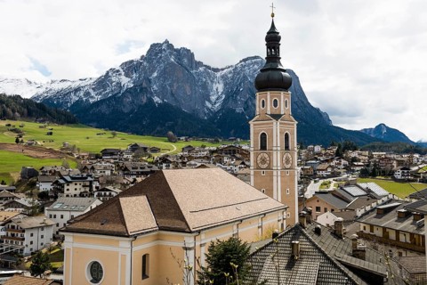 Village and snow-capped mountains