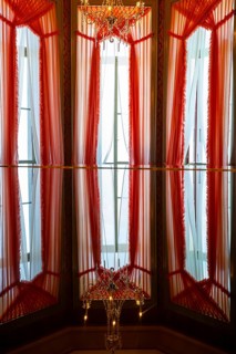 Beautiful Windows with Curtains and Crystal Lamp and Reflection in Switzerland