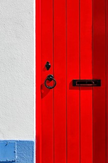 Red wooden door with fittings