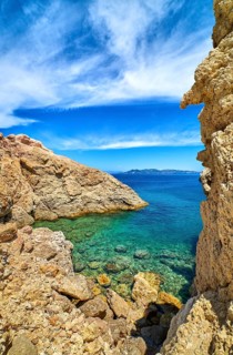 Majestic rocks of Greek island landscape. Sunny summer day