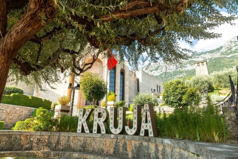 Kruja lettering on Kruje Castle and its fortress with walls. Albania
