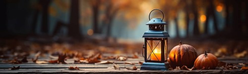 Warm and inviting lit vintage lantern resting on wood planks base outdoors in a fall setting