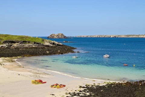 Small bay with canoes on the island of Ouessant
