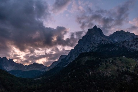 Night falls in the Valbona Valley along a trail