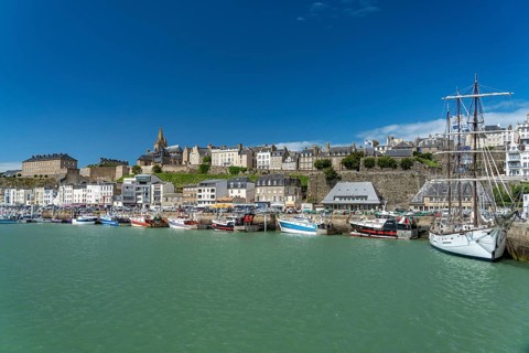 Town view with harbour and three-master Le Marite