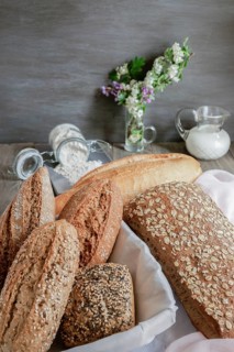 Loaves and loaves of rustic artisan bread made with different types of seeds and flours
