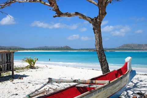 Small boat lying in the sand on the beach
