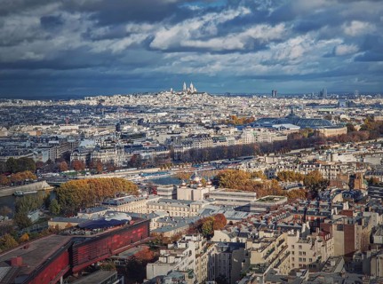 Panoramic view over the Paris city to the Sacre Coeur de Montmartre basilica on the hill