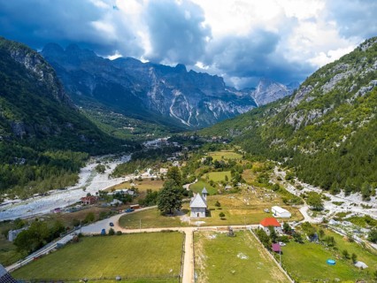 Aerial drone view over the Catholic Church in the valley of Theth national park