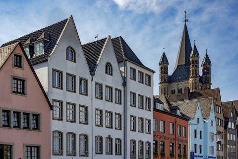 Gabled houses in the old town of Cologne at the Fischmarkt and the church Gross St. Martin
