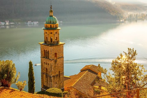 Church Tower Santa Maria del Sasso with Sunlight and Mountain on Lake Lugano in Morcote