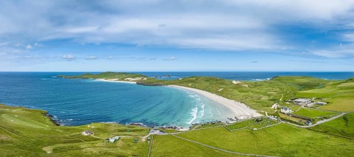 Aerial panorama of Balnakeil Bay with sandy beach and dunes
