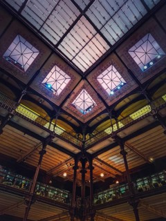 Architectural details of the glowing glass ceiling inside the Museum of Natural History