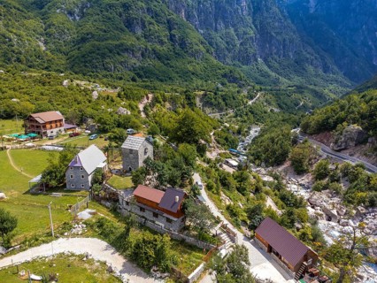 Aerial view over Nikoll Koceku tower in the valley of Theth national park