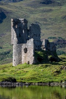 The ruins of Ardvreck Castle on a peninsula in the freshwater loch of Loch Assynt