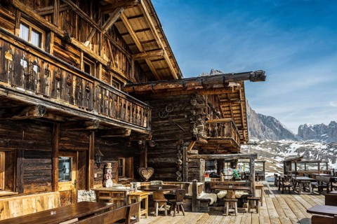 Snow-covered mountains and ski hut