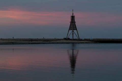 Kugelbake with water reflection in the sunset