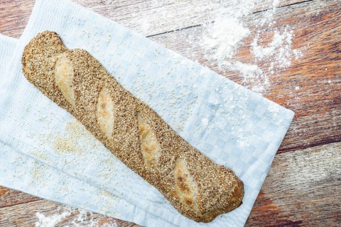 Freshly baked vegan baguette with sesame seeds