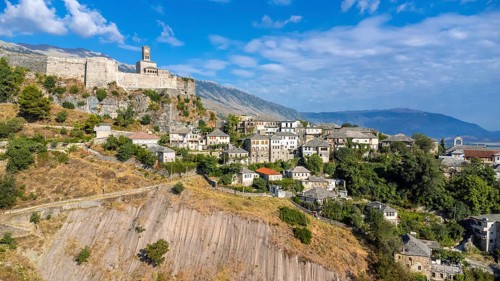 Aerial drone view of the old castle and fortress of the city of Gjirokaster or gjirokastra