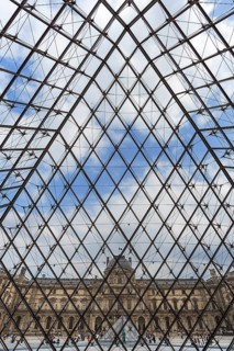 View from inside the pyramid to the buildings of the Louvre
