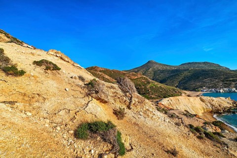 Unique natural rock formations of yellow and orange cliffs in low sunlight