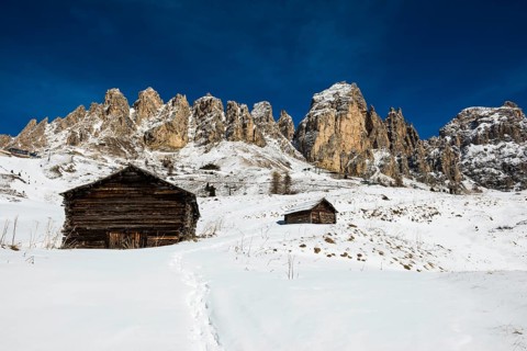 Snow-covered mountains and alpine hut