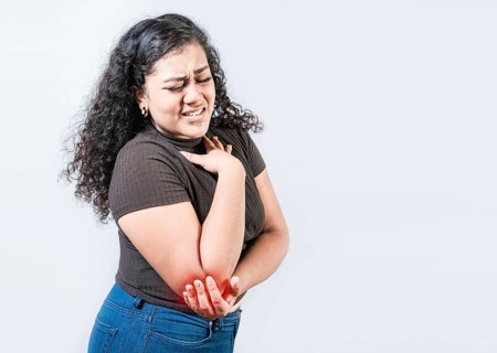 People with elbow pain isolated. Woman with elbow pain from rheumatism. Young girl suffering cramp elbow isolated