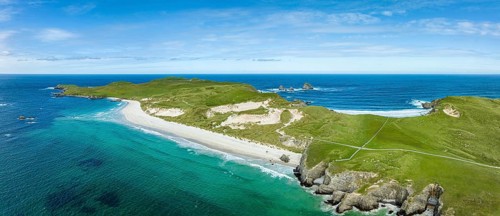 Aerial panorama of Faraid Head peninsula with dunes and sandy beach