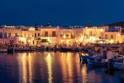 Traditional Greek fishing village and harbour after sunset