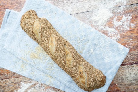 Freshly baked vegan baguette with sesame seeds