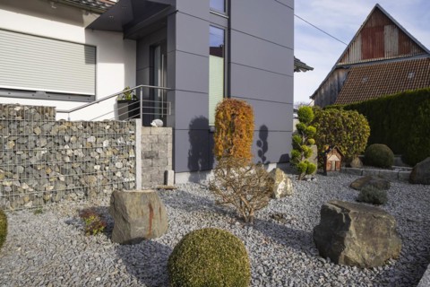 Gravel garden in front of a detached house