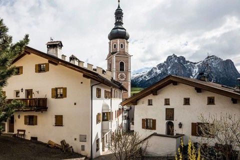 Village and snow-capped mountains