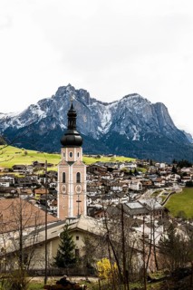Village and snow-capped mountains