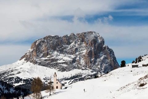 Snow-covered mountains and chapel