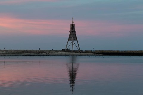 Kugelbake with water reflection in the sunset