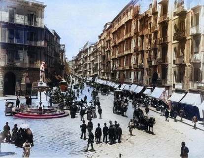 View of Via Roma in Naples with a statue