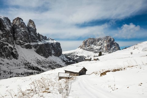 Snow-covered mountains and alpine hut