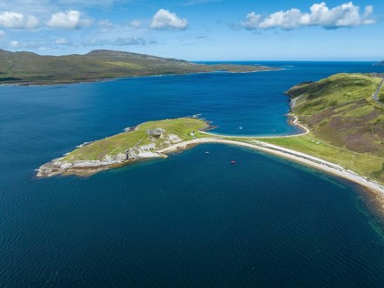 Aerial view of the Ard Neaki peninsula in the sea loch of Loch Eribol with the abandoned lime kilns and ferry house